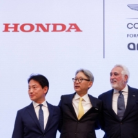 (From left) Honda Motor CEO Toshihiro Mibe, Honda Racing Corporation President Koji Watanabe, Aston Martin Aramco Cognizant Formula One Team Chairman Lawrence Stroll and Aston Martin Performance Technologies group CEO Martin Whitmarsh pose for photos at a news conference announcing their upcoming Formula One team partnership on Wednesday. | REUTERS