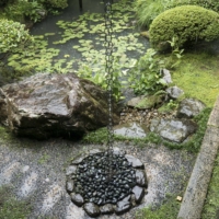 Water pours down a kusaridoi (rain chain) at Eikan-do temple in Kyoto. | STEPHEN MANSFIELD
