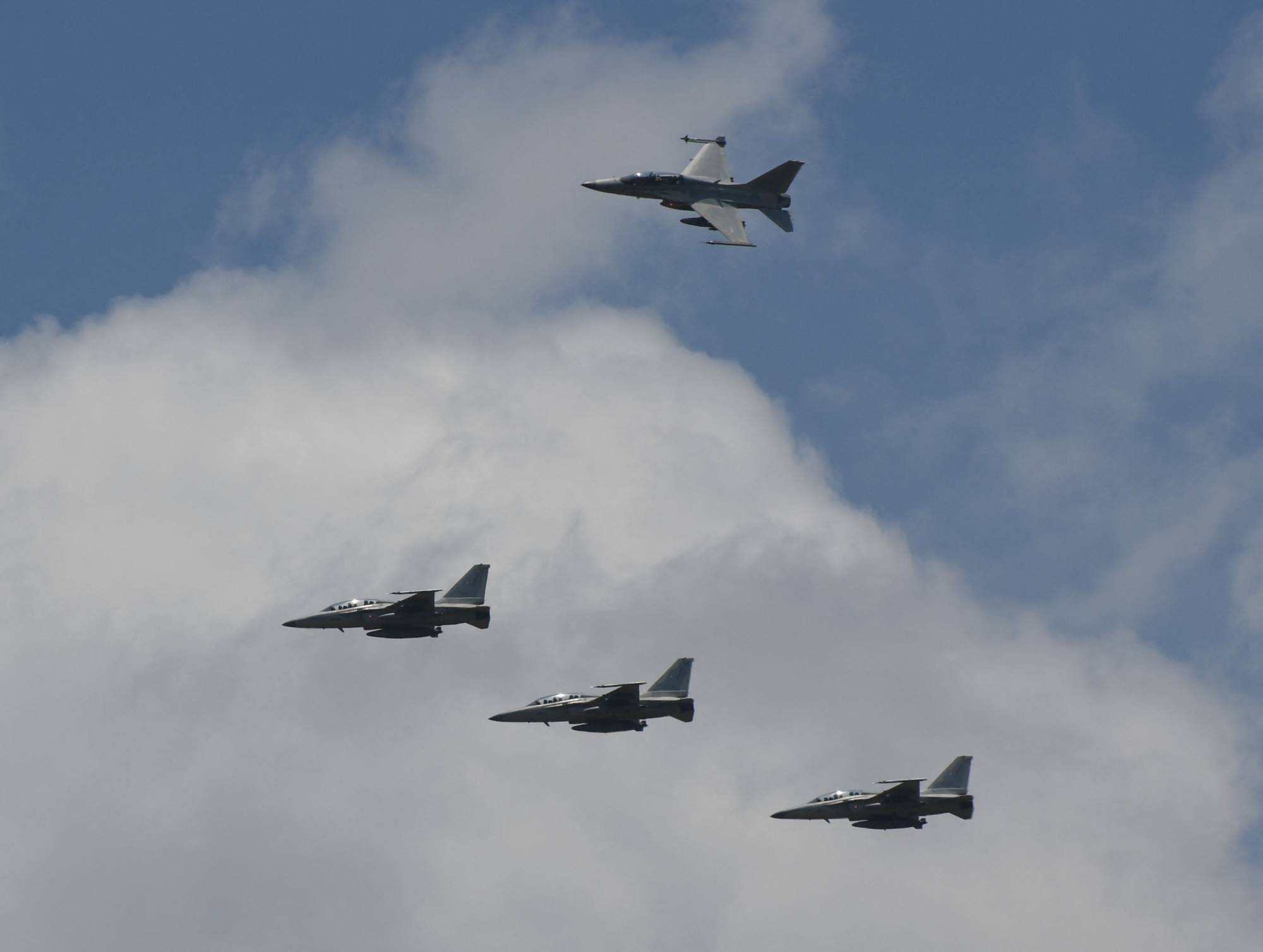 U.S. air force F-16 fighter jets fly in formation during a U.S.-Philippines air force joint military exercise at the former U.S. Clark air base in Angeles City, Pampanga province, north of Manila, on May 9. | AFP-Jiji