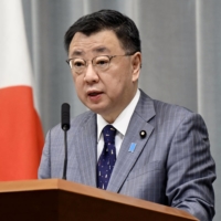 Chief Cabinet Secretary Hirokazu Matsuno speaks during a news conference at the Prime Minister\'s Office on Friday. | KYODO