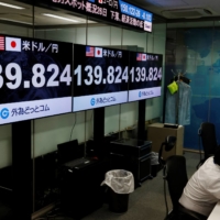 The office of a foreign exchange trading company in Tokyo on Friday | REUTERS