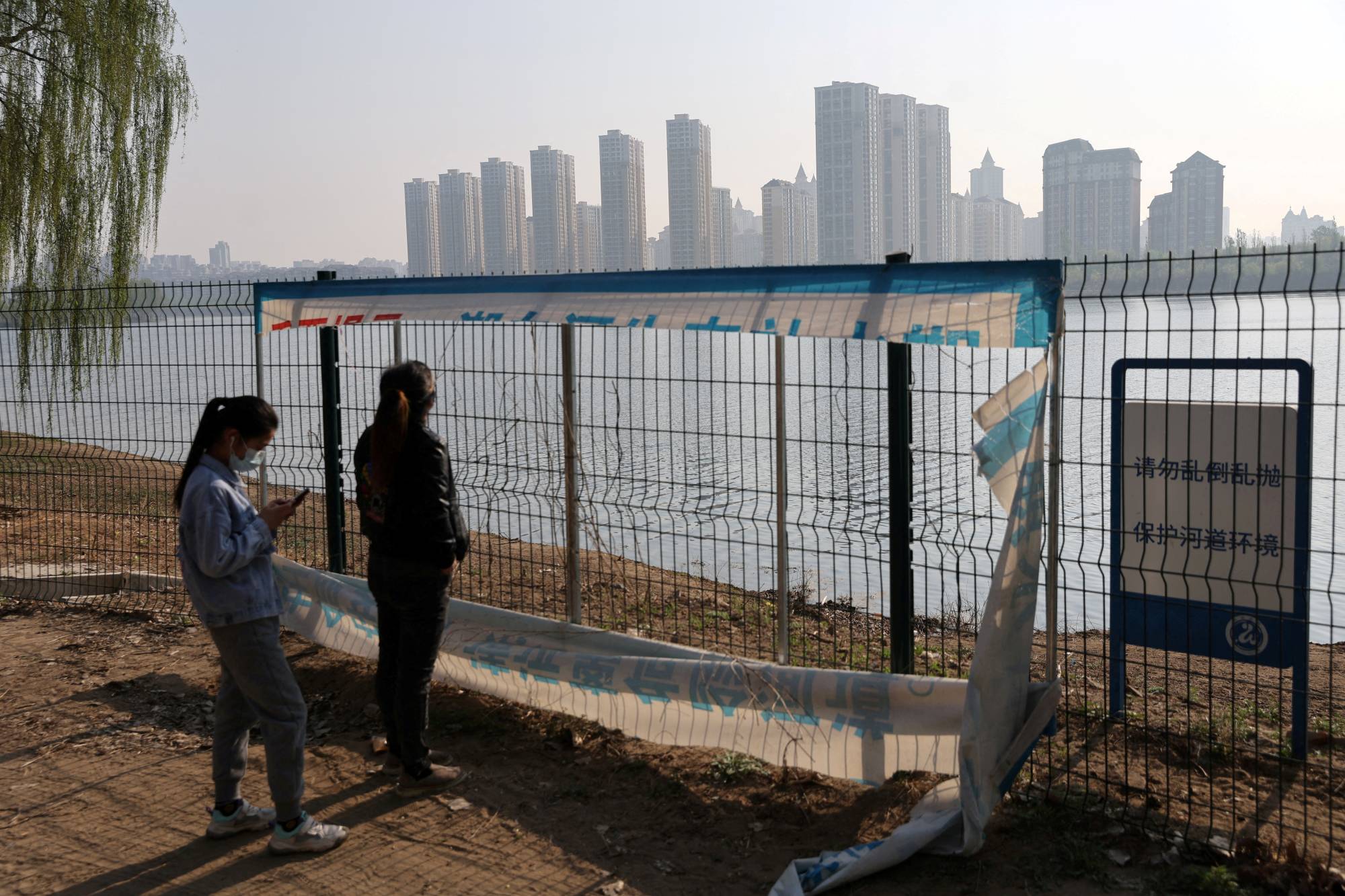A riverside area of Beijing in April. Chinese health authorities have reported a rise in COVID-19 cases since April, especially from newer subvariants that are spreading across the world. | Reuters