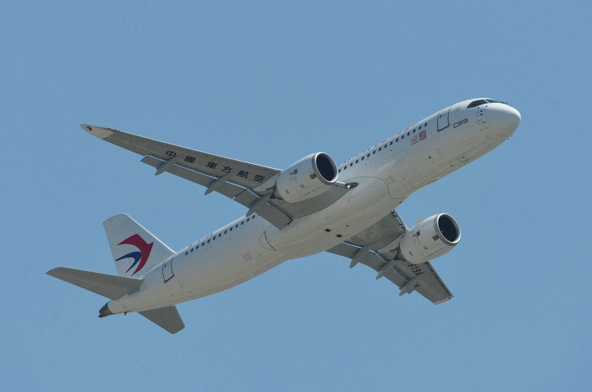 China's first domestically produced passenger jet, the C919, during its first commercial flight in Shanghai on Sunday.  | AFP-JIJI