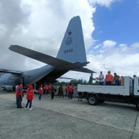 This undated photo shows Philippine police and coast guard personnel unloading relief supplies from an air force C-130 transport plane at Basco Airport near Manila in preparation for Super Typhoon Mawar. 

  | TACTICAL OPERATIONS GROUP-PHILIPPINE AIR FORCE (TOG 2- PAF) / VIA AFP-JIJI
