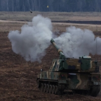 A K9 howitzer fires during a military drill in Poland on Mar. 30. | REUTERS