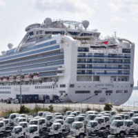 The Diamond Princess cruise ship docks at Yokohama Port on March 10, returning to the port for the first time in three years after services were suspended amid the COVID-19 pandemic. | KYODO
