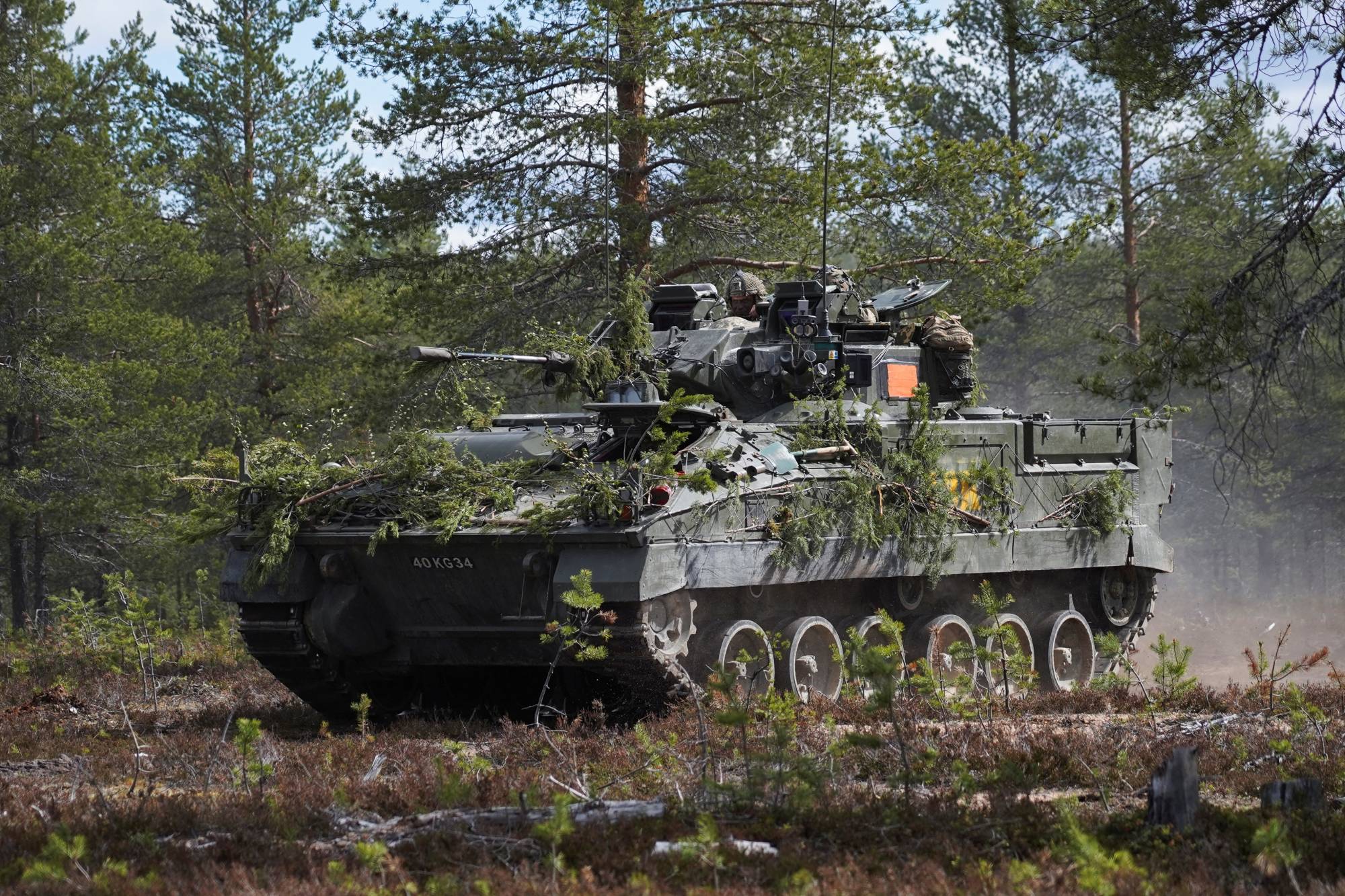 A British Warrior infantry fighting vehicle advances during the Northern Forest land force exercise in Rovajarvi on Tuesday. | REUTERS