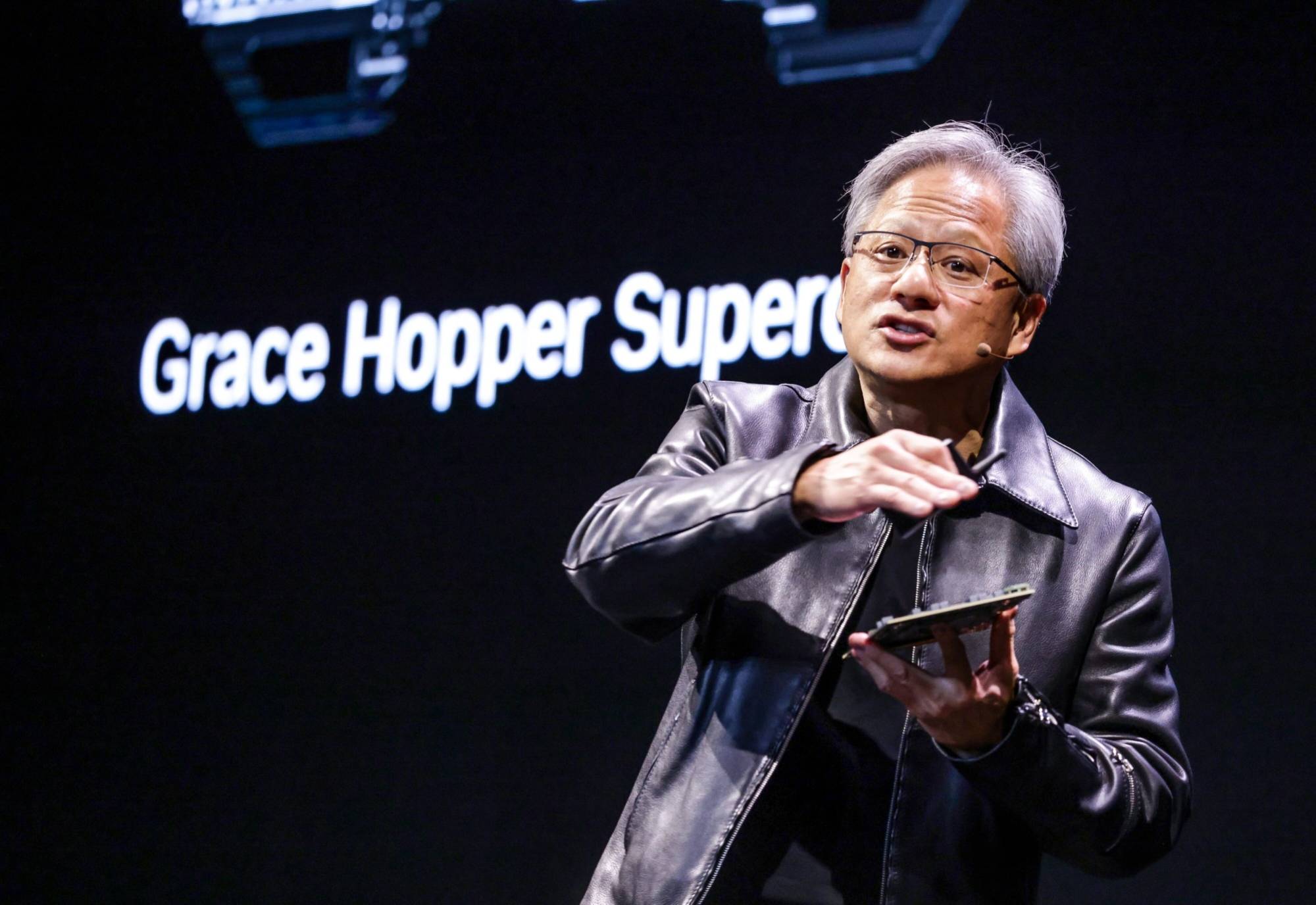 Jensen Huang, co-founder and chief executive officer of Nvidia Corp., speaks during the Taipei Computex expo on Monday. During his two-hour presentation, Huang unveiled a new batch of products and services tied to artificial intelligence, looking to capitalize on a frenzy that has made his company the world’s most valuable chipmaker. | BLOOMBERG