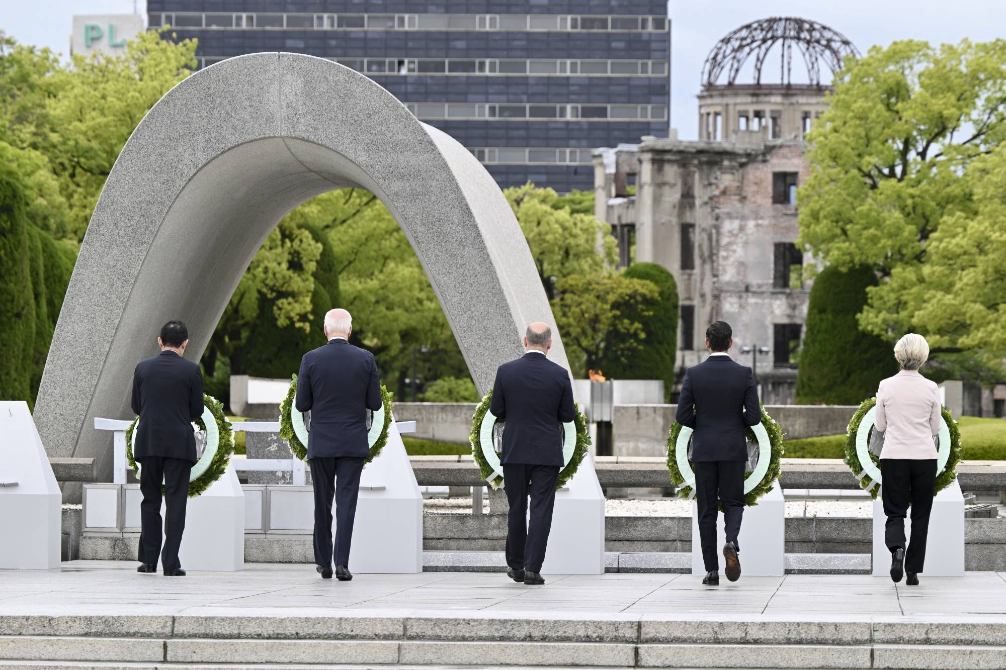 G7 leaders during a wreath-laying ceremony at the Hiroshima Peace Memorial Park on May 19, in view of the Atomic Bomb Dome, one of the few structures to survive the 1945 bombing of the city | KENNY HOLSTON / THE NEW YORK TIMES
