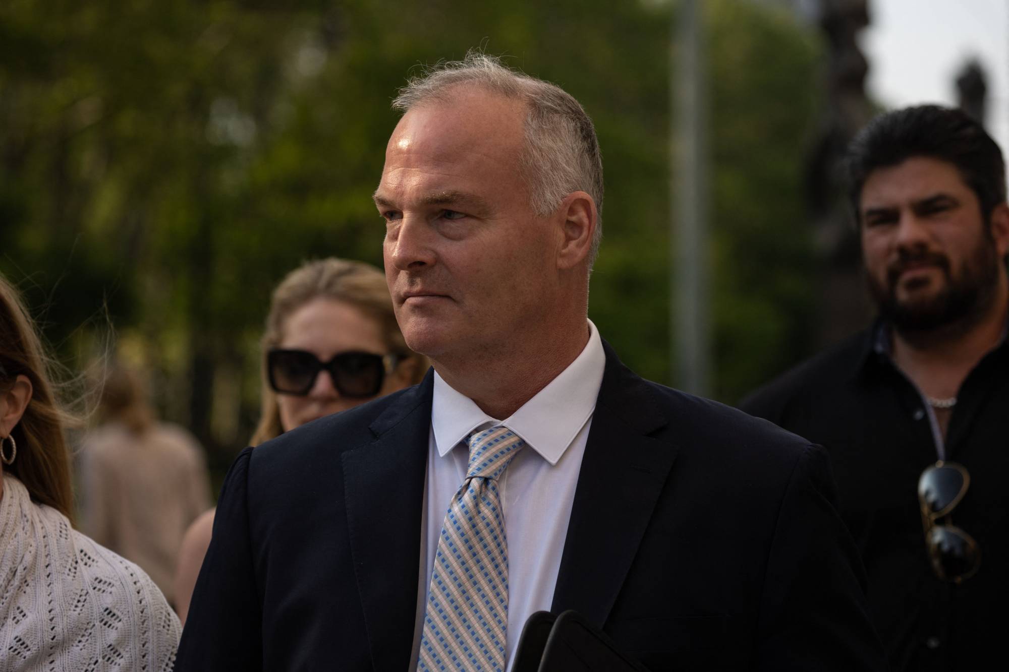 Retired NYPD sergeant Michael McMahon leaves the Brooklyn Federal Court Building. America's first federal trial over China's alleged attempts to forcibly repatriate its citizens under a campaign known as 'Operation Fox Hunt' got underway in New York on Wednesday. | AFP-JIJI