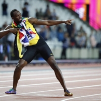 Usain Bolt poses after the 100-meter final during the World Athletics Championships in London on Aug. 5, 2017. | REUTERS