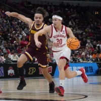 Nebraska guard Keisei Tominaga drives to the basket against Minnesota\'s Braeden Carrington during the Big Ten Tournament in Chicago on March 8. | USA TODAY / VIA REUTERS