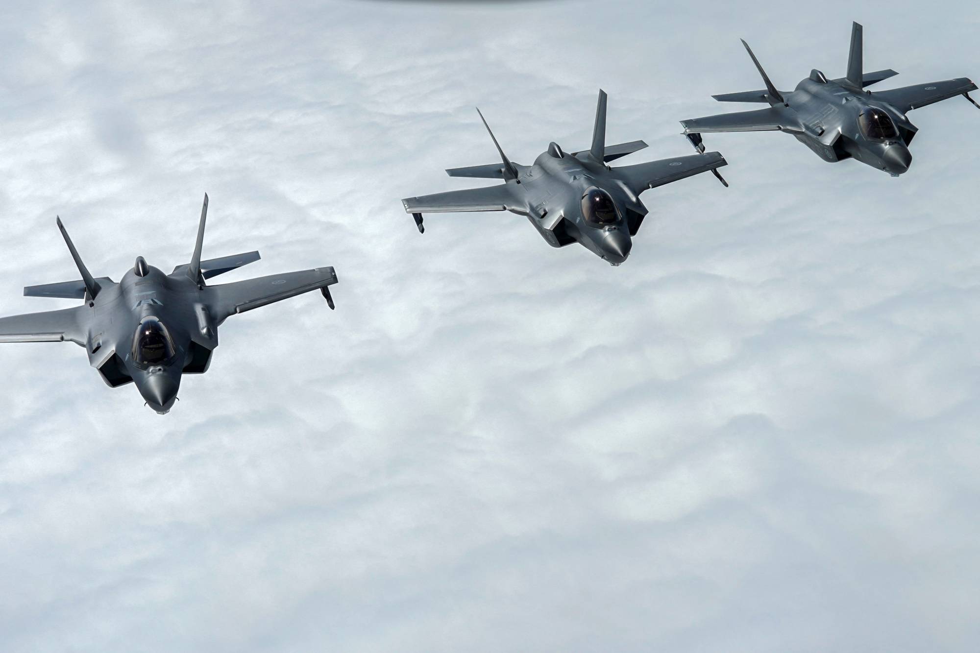 Norwegian F-35 Lightning fighter jets fly during the Arctic Challenge Exercise near Orland Main Air station, Norway, on Thursday. Around 150 aircraft from 14 countries as well as NATO are participating and are flying from four bases, two in Finland, one in Sweden and Orland in Norway.  | AFP-JIJI