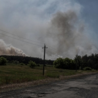 Smoke rises over an area of the Ukraine-Russia border in Ukraine\'s Kharkiv region on Sunday.  | REUTERS