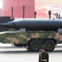 Military vehicles carrying underwater drones travel past Tiananmen Square during a parade in Beijing in 2019.  | REUTERS