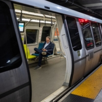 A commuter on a Bay Area Rapid Transit train in San Francisco in 2022. | BLOOMBERG