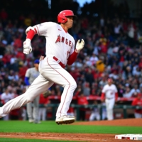 Angels designated hitter Shohei Ohtani rounds the bases after his solo home run against the Clubs in Anaheim, California, on Tuesday. | USA TODAY / VIA REUTERS