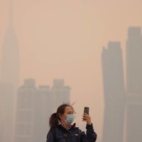 Haze and smoke caused by wildfires in Canada hang over the Manhattan skyline in New York on Wednesday. | REUTERS