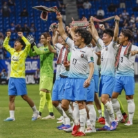 Kochi\'s players celebrate after their victory over Gamba in the Emperor\'s Cup in Suita, Osaka Prefecture, on Wednesday | KYODO