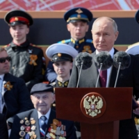 Russian President Vladimir Putin delivers a speech during a military parade on Victory Day, which marks the anniversary of the victory over Nazi Germany in World War II, in Red Square in central Moscow on May 9. | POOL / SPUTNIK / VIA REUTERS 