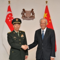 Chinese Defense Minister Li Shangfu meets his Singaporean counterpart, Ng Eng Hen, ahead of the Shangri-La Dialogue in Singapore on June 1. | SINGAPORE MINISTRY OF DEFENCE / VIA REUTERS
