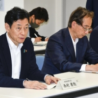 Industry minister Yasutoshi Nishimura (left) meets with local fisheries industry representatives in the city of Iwaki, Fukushima Prefecture, Saturday to seek their understanding for the planned release of treated water from the stricken Fukushima No. 1 nuclear power plant. | KYODO 