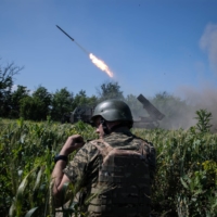 Soldiers with Ukraine’s 110th Separate Mechanized Brigade fire a missile toward enemy positions, in the Donetsk region of Ukraine on June 7.  | TYLER HICKS / THE NEW YORK TIMES