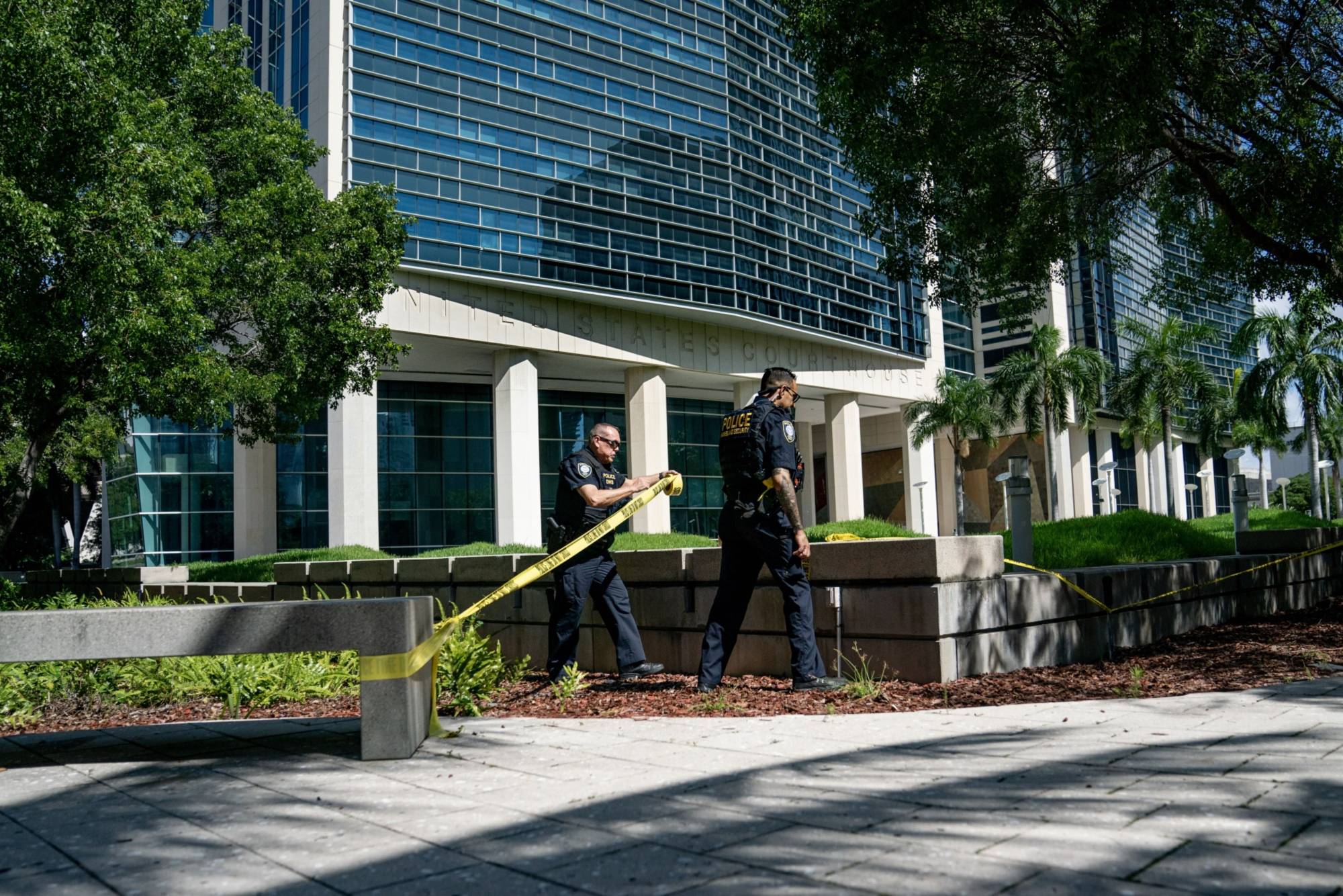 Department of Homeland Security officers set up a police line outside the Wilkie D. Ferguson Jr. United States Courthouse in Miami on Monday. | BLOOMBERG