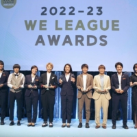 Selections to the WE League\'s Best Eleven, including league MVP Kozue Ando (center), pose onstage at the league\'s annual award ceremony on Monday. | KYODO