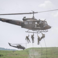 Ground Self-Defense Forces soldiers rappel from a helicopter during a live-fire exercise at the East Fuji Maneuver Area in Gotemba, Shizuoka Prefecture, on May 27. | AFP-JIJI