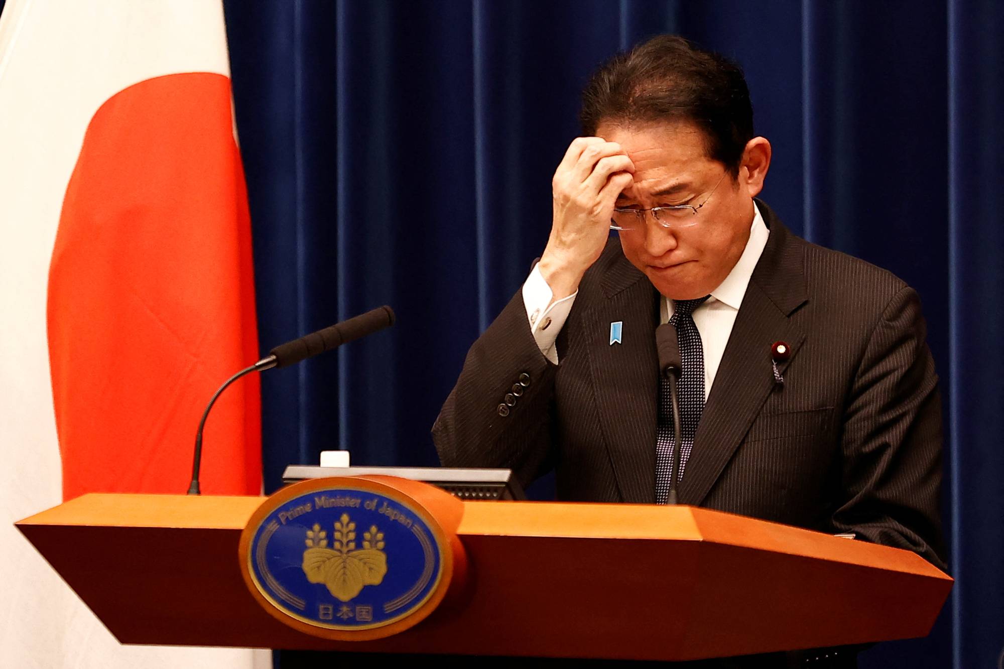Prime Minister Fumio Kishida listens to questions from the media during a news conference at the Prime Minister's Office in Tokyo on Tuesday.   | POOL / VIA REUTERS