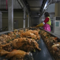 Food waste being processed at Dobong-gu Waste Disposal Facility in Dobong-gu, Seoul. South Korea, which banned food scraps from its landfills almost 20 years ago, now turns the vast majority of it into animal feed, fertilizer and fuel for heating homes.  | CHANG W. LEE / THE NEW YORK TIMES