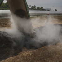 Fertilizer produced at Goyang’s biomass energy facility being delivered to a farm in Goyang-si, Gyeonggi Province, South Korea. Lettuce and bok choy are grown at the farm, in soil enriched by the fertilizer from the energy facility.  | CHANG W. LEE / THE NEW YORK TIMES