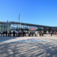 People wait in line to attend the Climate Change Conference in Bonn on June 6. | REUTERS
