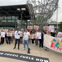 Activists hold an anti-fossil fuel protest at the pre-COP28 climate conference, in front of the United Nations building in Bonn, Germany, on June 7. | REUTERS
