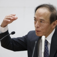 Kazuo Ueda, governor of the Bank of Japan, speaks during a news conference at the central bank\'s headquarters in Tokyo on Friday. | BLOOMBERG