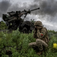 Ukrainian service members fire a self-propelled howitzer toward Russian troops, near the town of Avdiivka in the Donetsk region, Ukraine, on May 31. | REUTERS