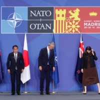 Australian Prime Minister Anthony Albanese, Prime Minister Fumio Kishida, Stoltenberg, then-New Zealand Prime Minister Jacinda Ardern and South Korean President Yoon Suk-yeol prepare to pose during a NATO summit in Madrid on June 29, 2022. | REUTERS