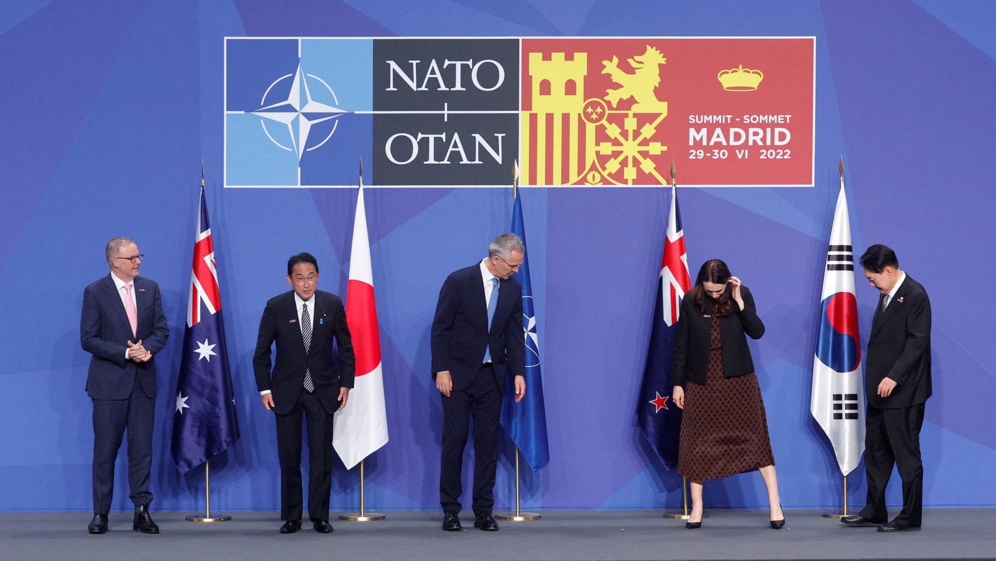Australian Prime Minister Anthony Albanese, Prime Minister Fumio Kishida, Stoltenberg, then-New Zealand Prime Minister Jacinda Ardern and South Korean President Yoon Suk-yeol prepare to pose during a NATO summit in Madrid on June 29, 2022. | REUTERS
