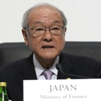 Finance Minister Shunichi Suzuki says Japan is closely monitoring currency moves after the dollar hit a seven-month high on Tuesday. | AP / VIA BLOOMBERG