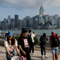 Tourists in Hong Kong in May. The pandemic-hit city is trying to revitalize its tourism sector.  | REUTERS