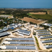 Solar panels cover the rooftops of cowsheds and chicken coops in Kibbutz Or HaNer, Israel.  | REUTERS