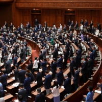 Lawmakers vote on a bill to revise the Penal Code at the House of Councilors in Tokyo on Friday. | AFP-JIJI