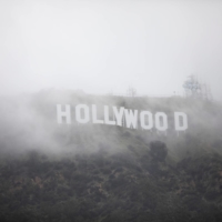 The Hollywood sign is seen through a mix of fog and snow during a rare winter storm in the Los Angeles area in February. American films have been getting a slightly chilly reception in Japan over the past 20 years, according to critic Hiroo Otaka. | REUTERS