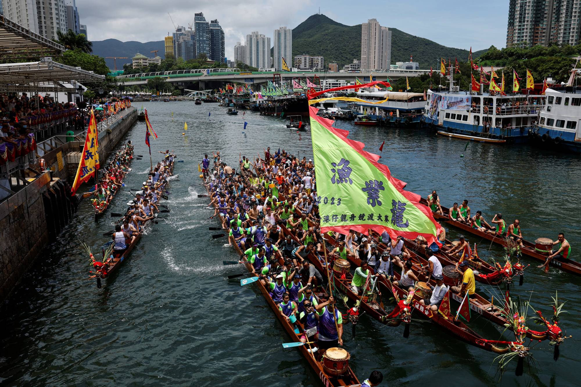 Dragon boats get together during a ceremony as part of the celebration to mark the annual Duanwujie, or Dragon Boat Festival, at Aberdeen fishing port in Hong Kong, China on Thursday. | REUTERS