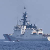 The U.S. Coast Guard\'s national security cutter Stratton takes part in drills during the first trilateral coast guard exercise between the Philippines, Japan and the U.S., off the coast of Bataan, the Philippines, in the South China Sea on June 6. | REUTERS