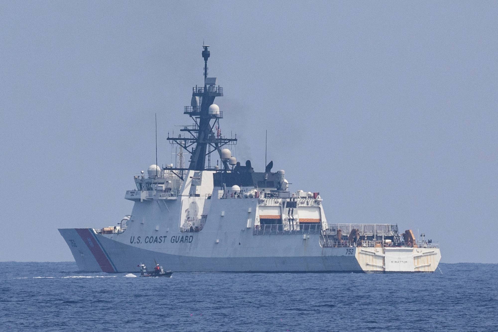 The U.S. Coast Guard's national security cutter Stratton takes part in drills during the first trilateral coast guard exercise between the Philippines, Japan and the U.S., off the coast of Bataan, the Philippines, in the South China Sea on June 6. | REUTERS