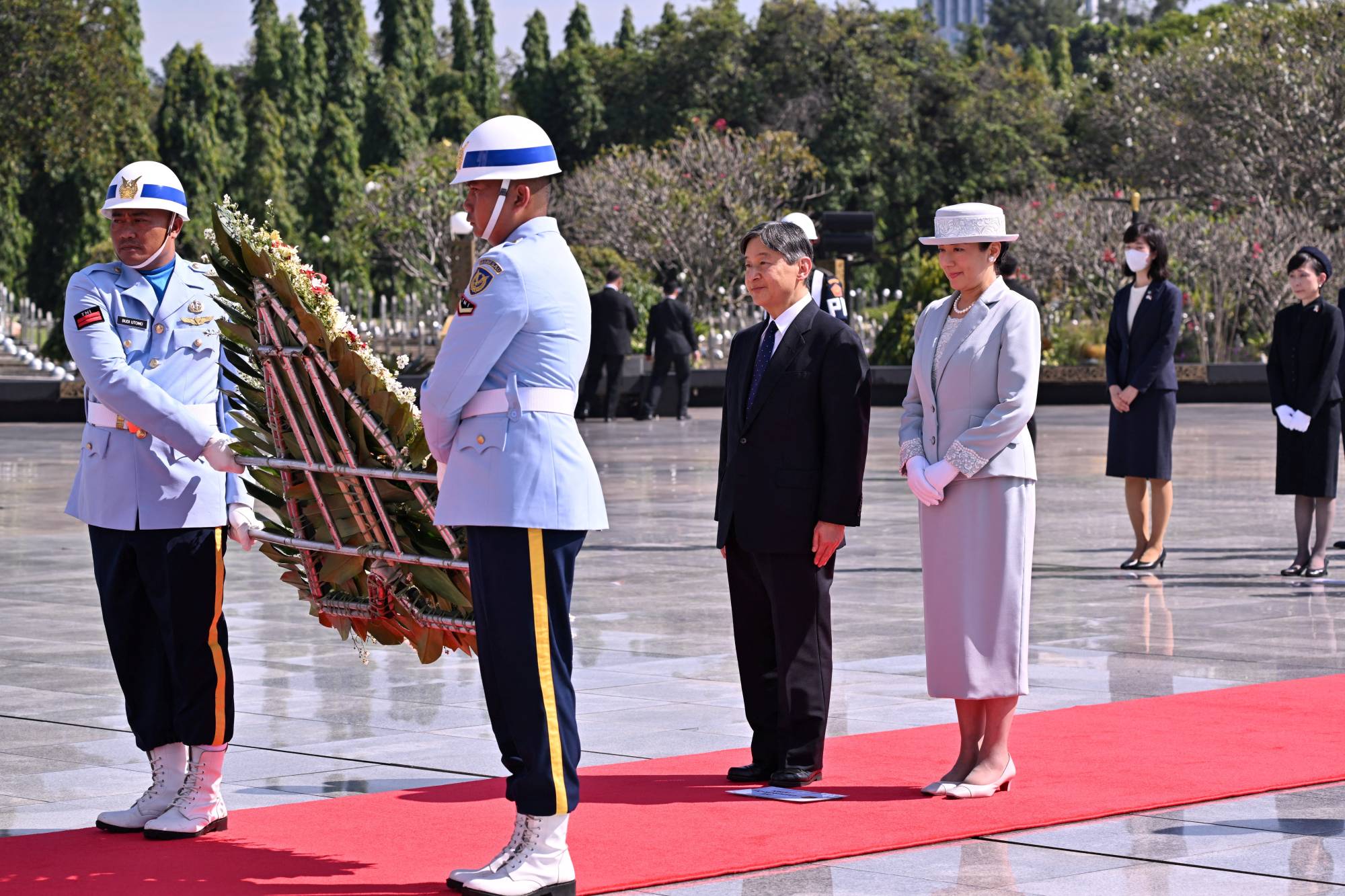 Emperor Naruhito and Empress Masako participate in a wreath-laying ceremony at the Kalibata national heroes cemetery in Jakarta on June 20. | POOL / VIA REUTERS