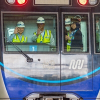Emperor Naruhito (left) waves during a visit to a site of Jakatra\'s Mass Rapid Transit system on June 18. | PT. MRT JAKARTA / VIA AFP-JIJI