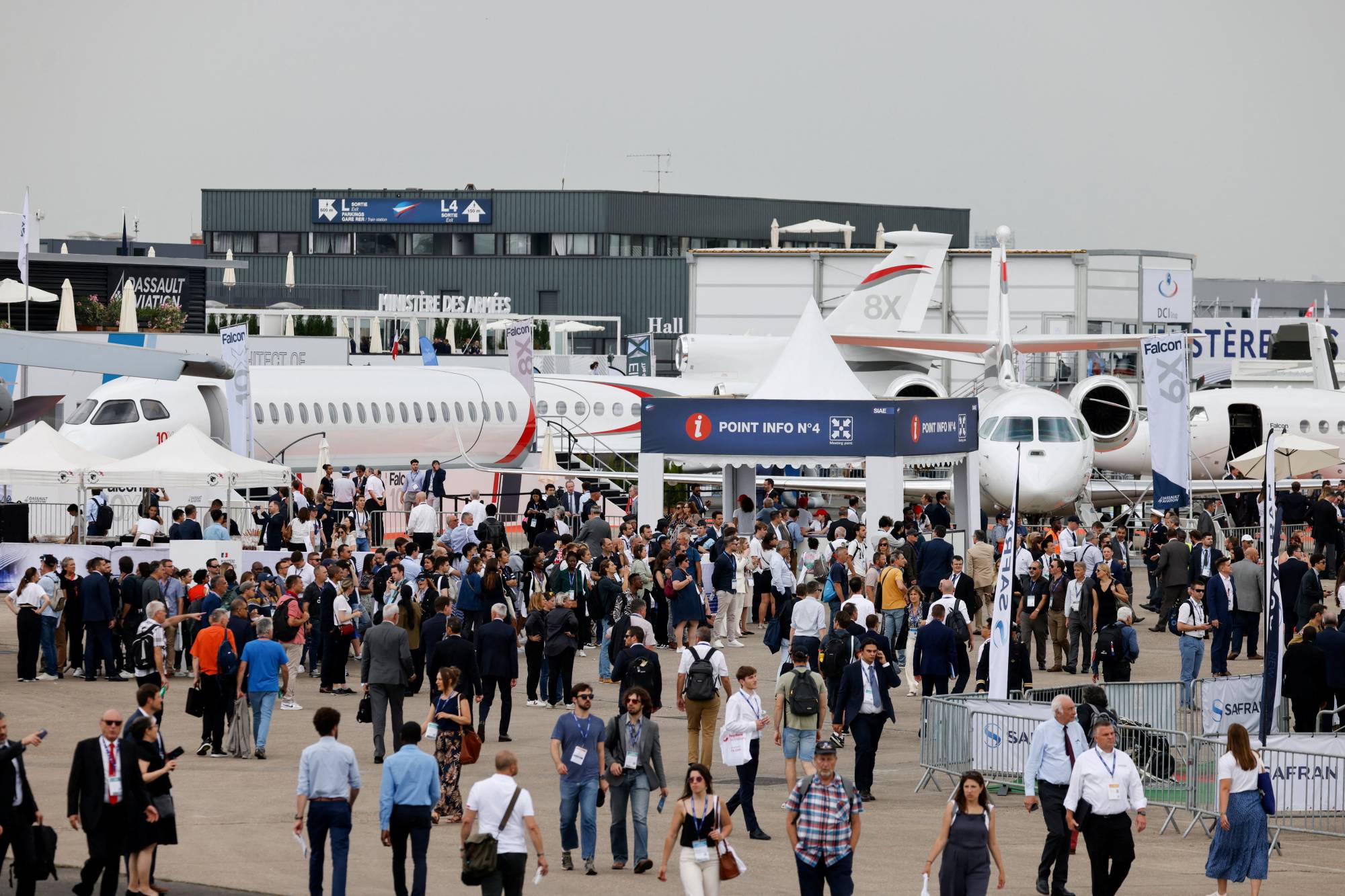 Visitors attend the International Paris Air Show at the Paris-Le Bourget Airport, France, on Monday. | POOL / VIA REUTERS